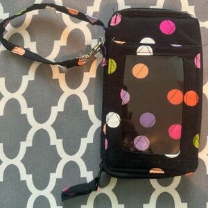 Brand new, colorful, polka dotted wristlet/clutch.